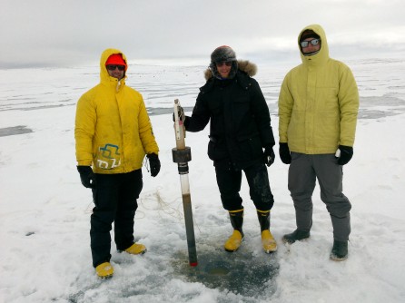 Matthew Gillman, Benjamin Amann, and Casey Beel with a recovered sediment core